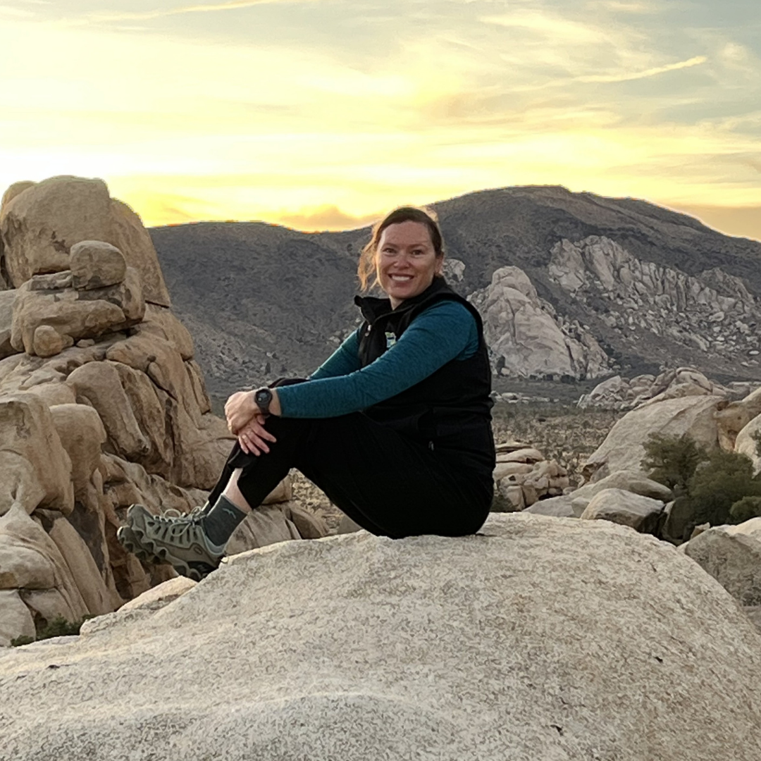 Julie Kallenberger sits on top of a rock
