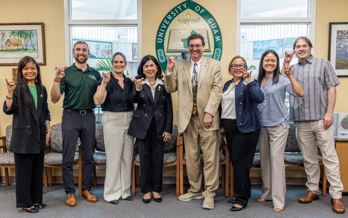 group of eight people posing for a picture