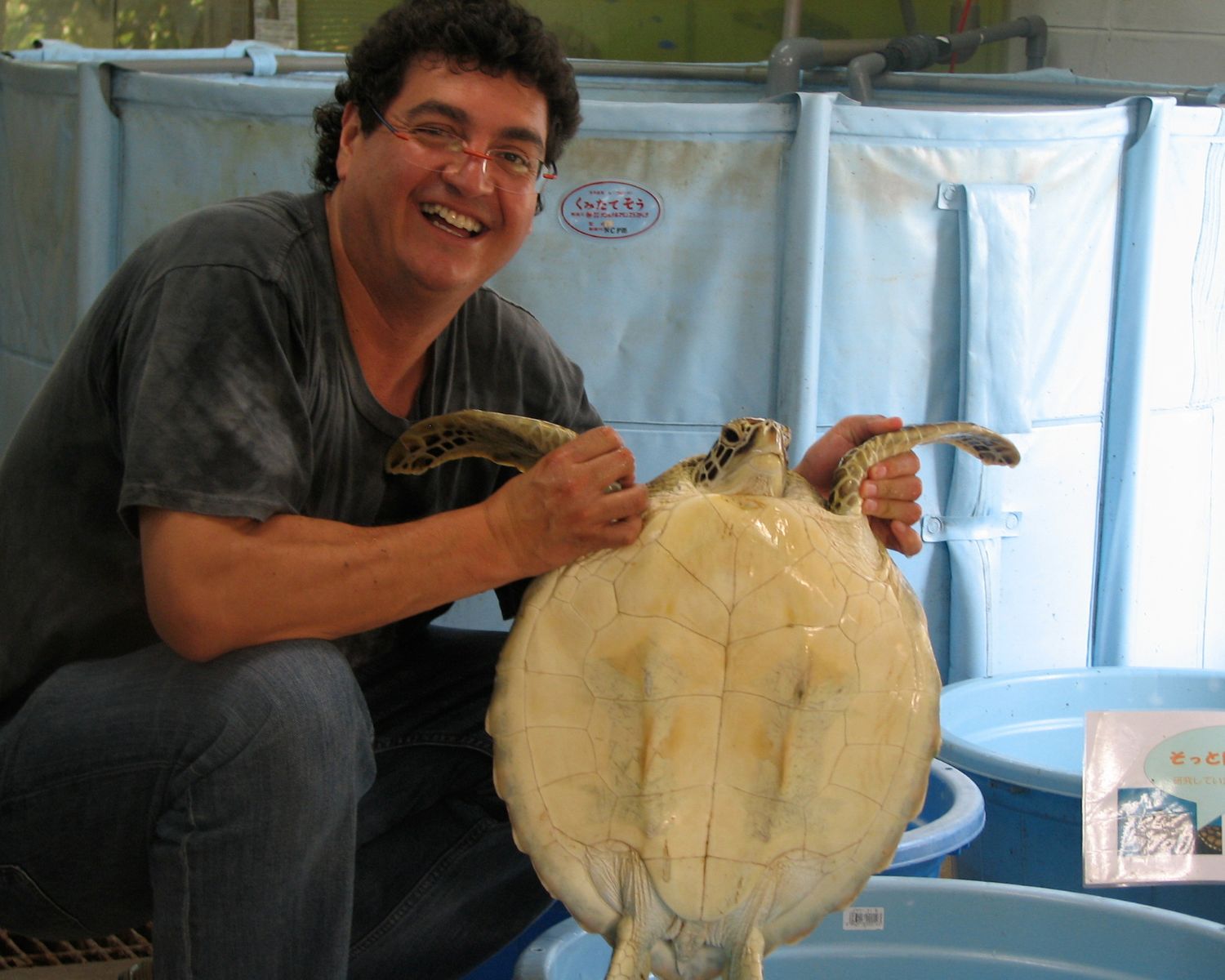 A. Alonso Aguirre holds a turtle