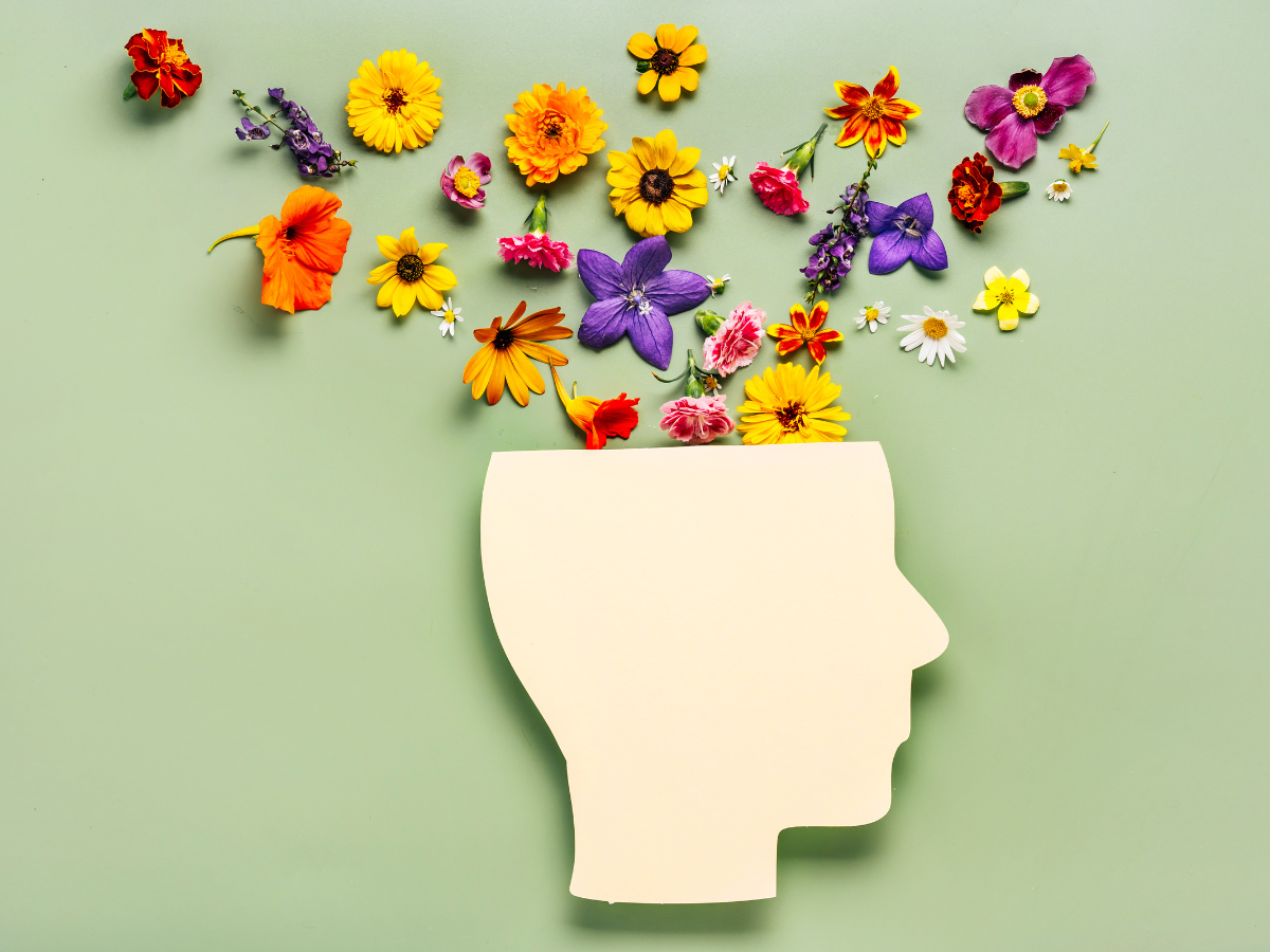 a graphic of a person with flowers coming out of the top of their head