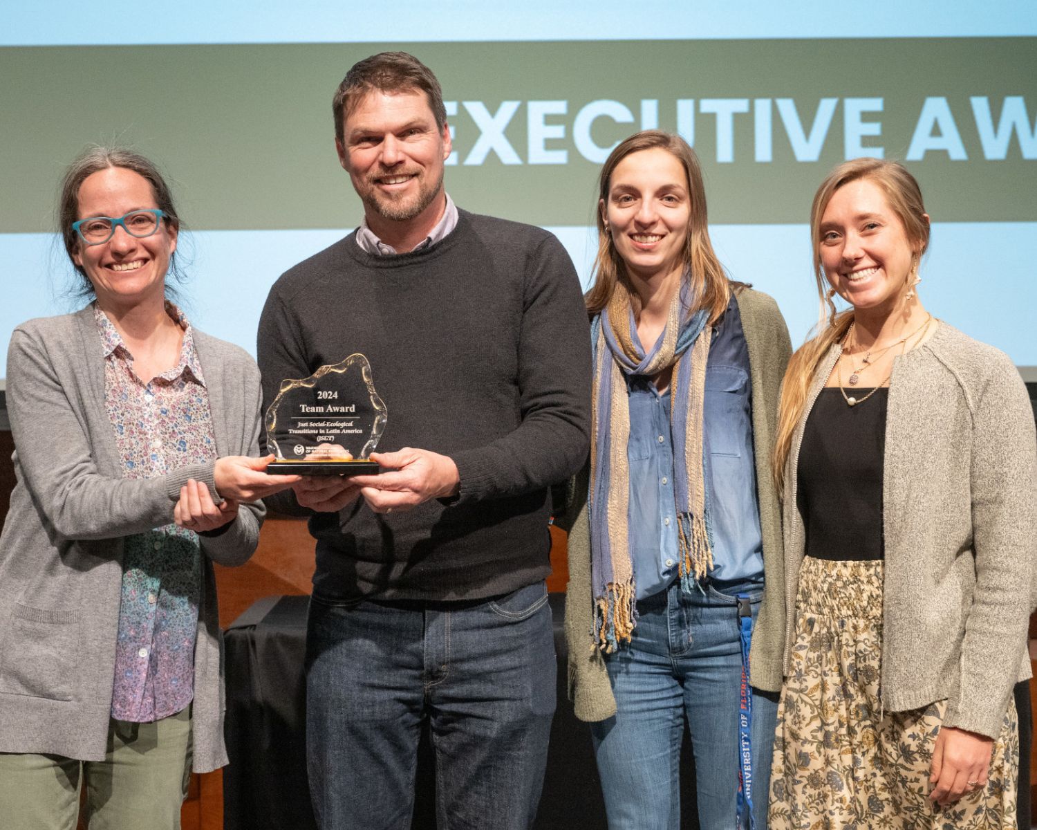 People posing with their awards at the reception