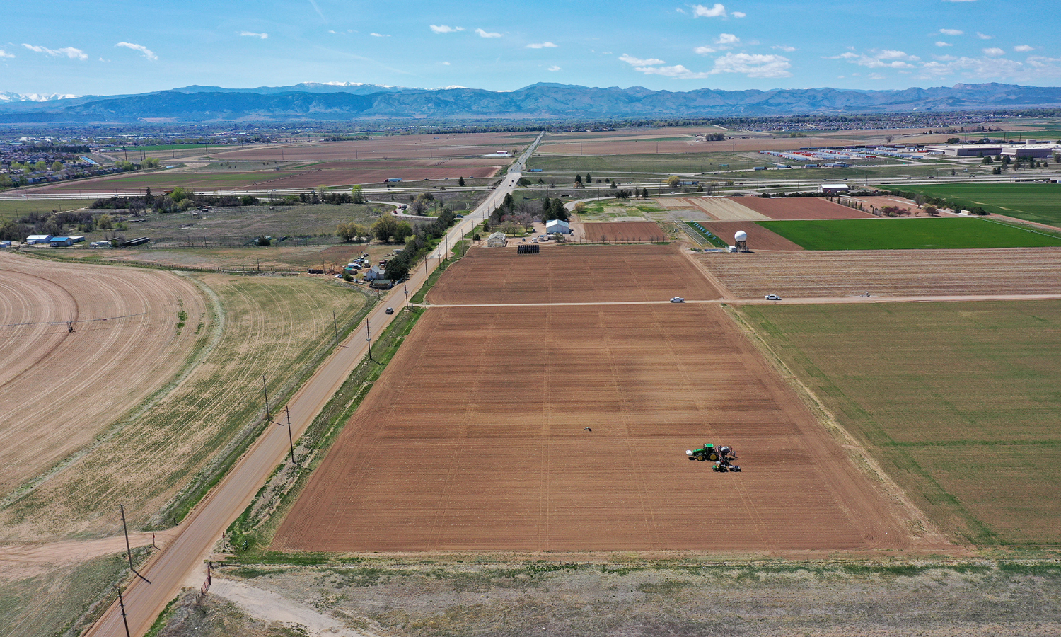 Aerial view of Colorado farmland with the mountains in the background. 
