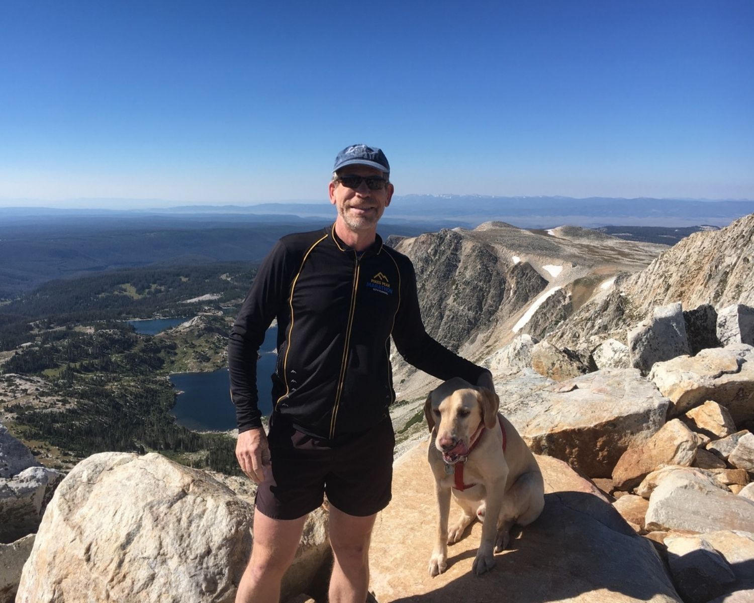 photo of Rick Aster with a dog in Medicine Bow Peak, WY