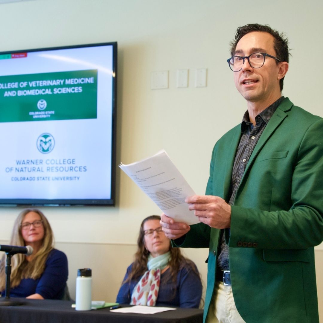 A person presenting at the 2025 International Symposium