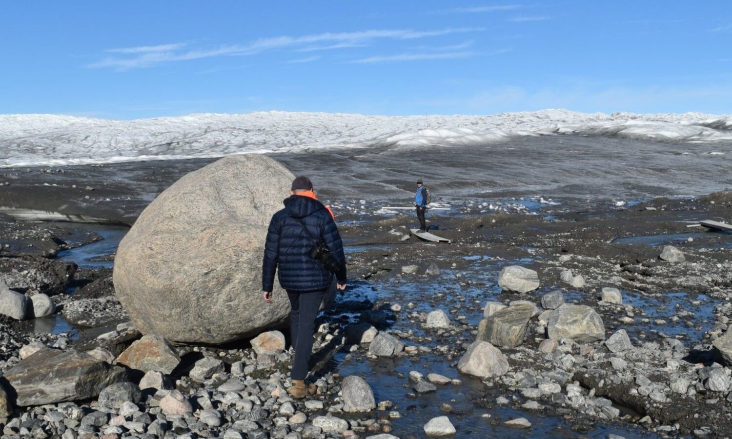 Photo of a person walking on rocks
