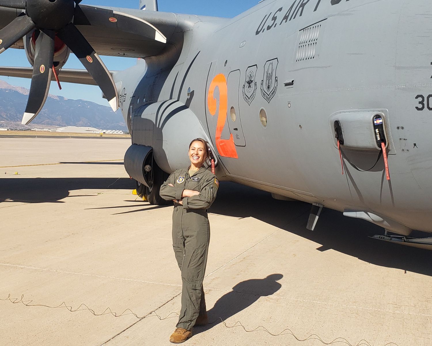 Photo of Elisa McGhee in front of a plane