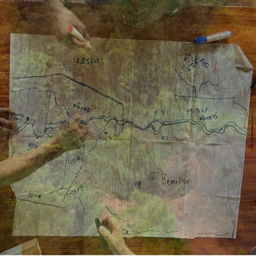 A graphic of an aerial view of a map with people writing on the map with markers.