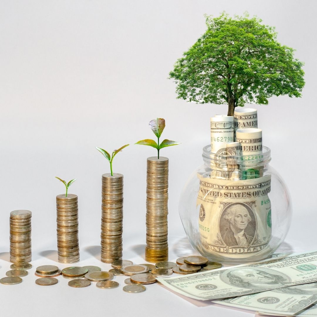 Stacks of coins get larger to imply increasing wealth
