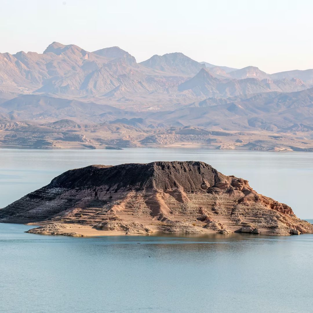 A rock formation in the middle of Lake Mead showing low water levels. 
