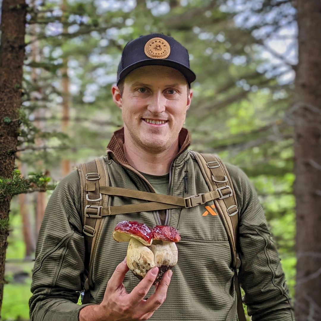 Photo of Orion Aon holding a mushroom 