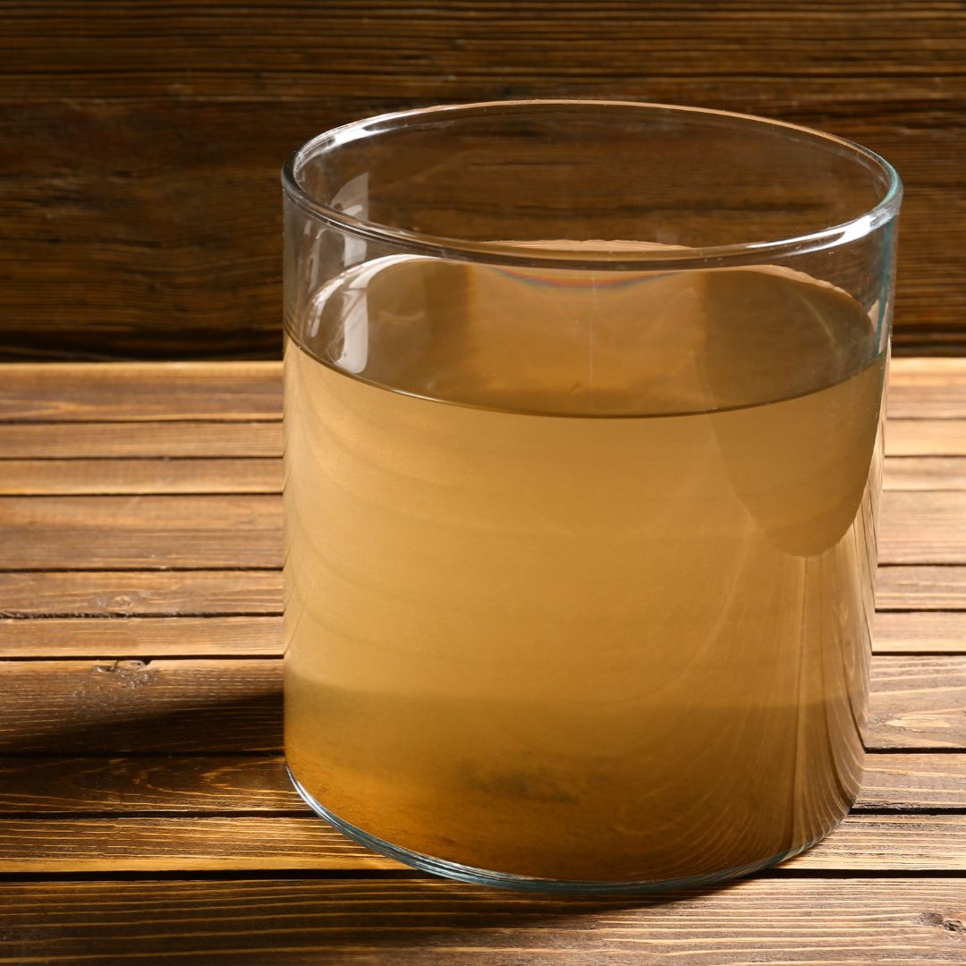 A glass containing murky water