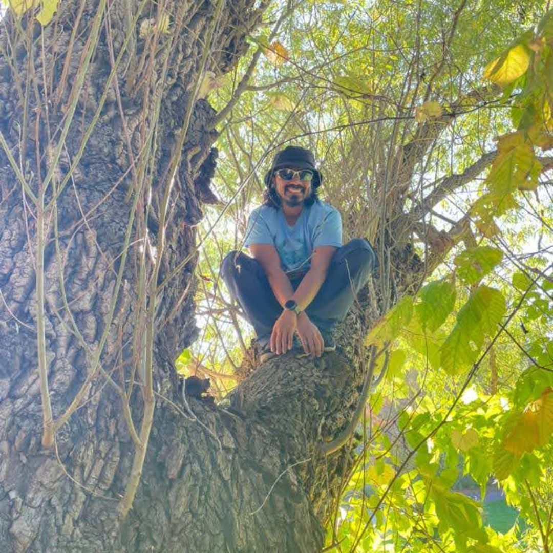 Photo of Mohammed Saif sitting in a tree