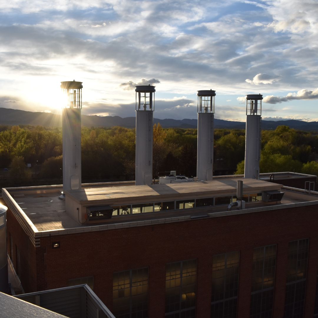 The Powerhouse Energy Campus with the mountains and setting sun in the background. 